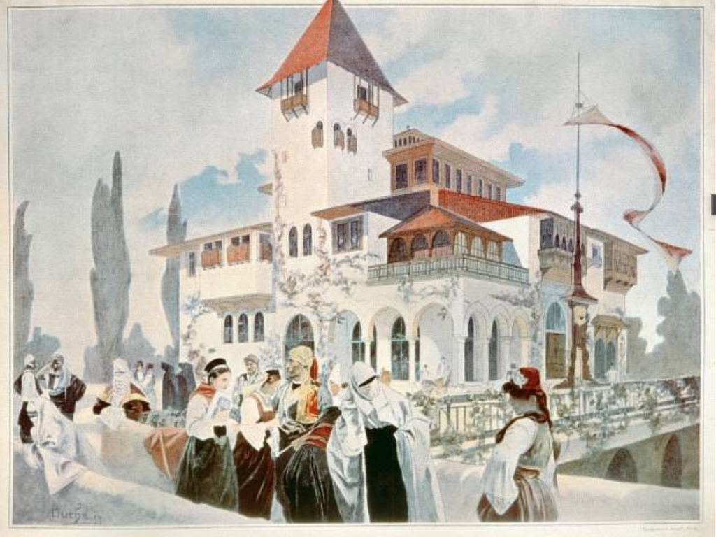 a bustling scene of eclectically robed people infront of a white building with a red, turreted roof.
