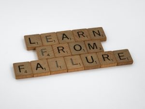 scrabble letters reading "learn from failure"