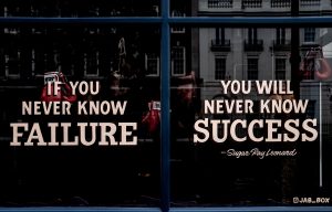 Window sign reading "If you never know failure you will never know success" - Sugar Ray Lemonade