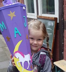 Maja on her first day of school holding a Schultüte