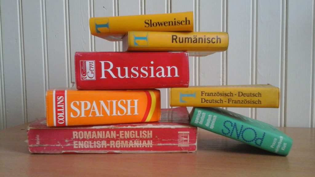 stack of various dictionaries
