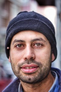 man wearing a hat with a beard