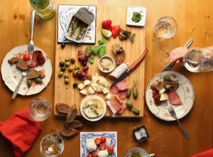 supper table (meats, cheese, bread)