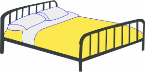 black metal bed frame with yellow blanket