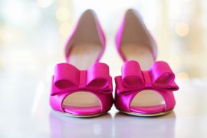 pink high heel shoes with a bow