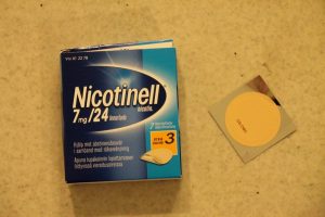 Box of  7mg Nicotinell nicotine patches with one example outside the box