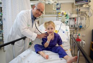 pediatrician providing care to a young child