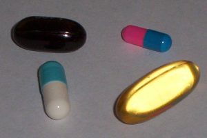 Four examples of medication in gelatin capsules (gelcaps)