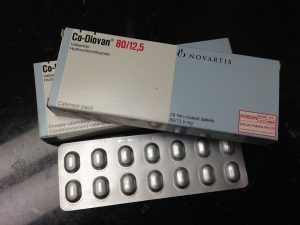 A box and blister packs of Co-Diovan Valsartan Hydrocholaorthiaizde tablets from the manufacturer Novartis.