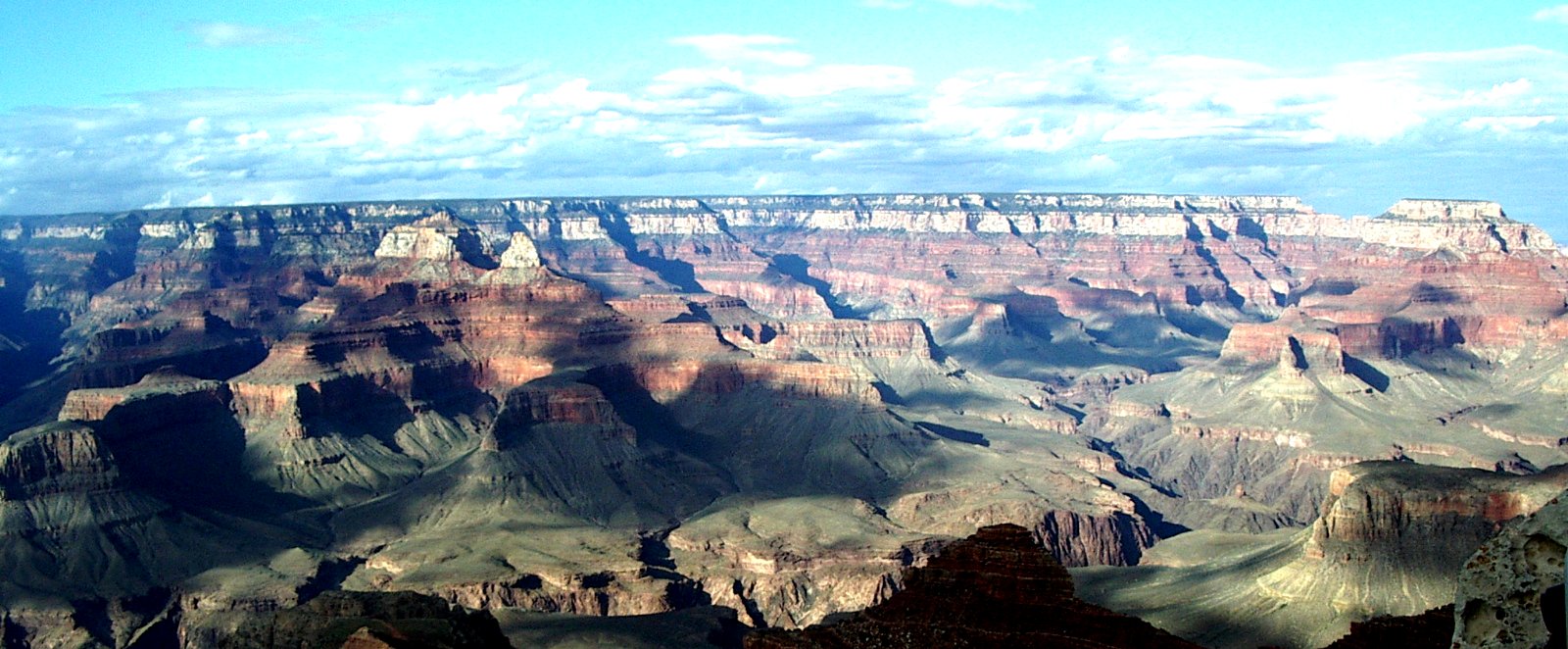 Figure 7.0.1: Arizona’s Grand Canyon is an icon for geological time; 1,450 million years are represented by this photo. The light-coloured layered rocks at the top formed at around 250 Ma, and the dark rocks at the bottom (within the steep canyon) at around 1,700 Ma.