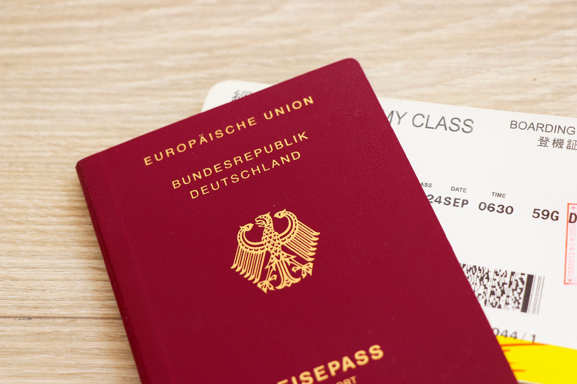 German passport (red) and boarding pass