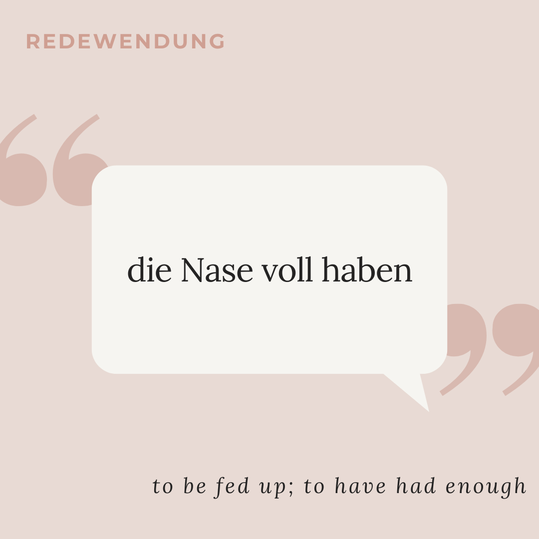 speech bubble with "Die Nase voll haben" - to be fed up; to have had enough